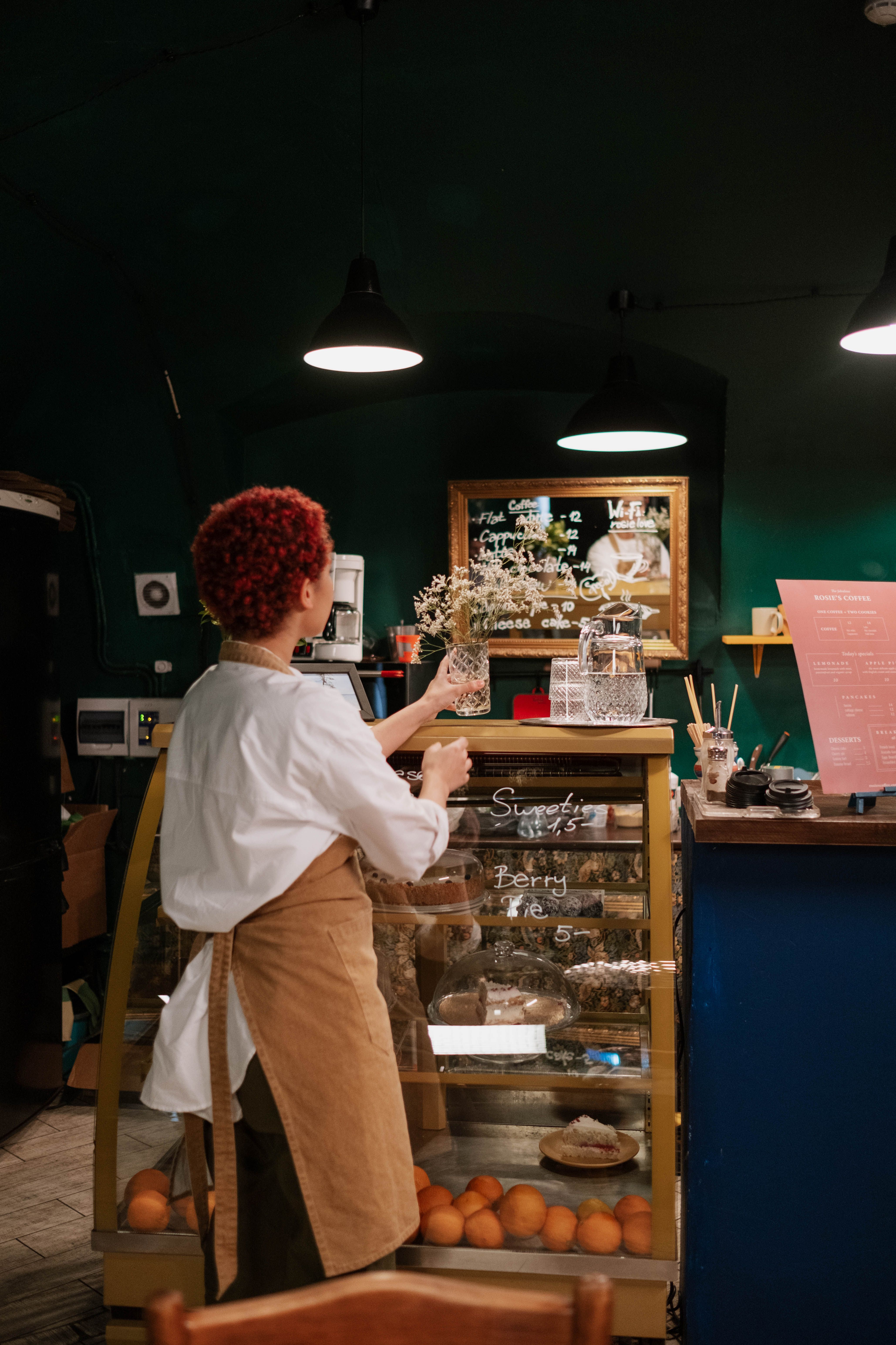 Woman Clearing the Counter · Free Stock Photo