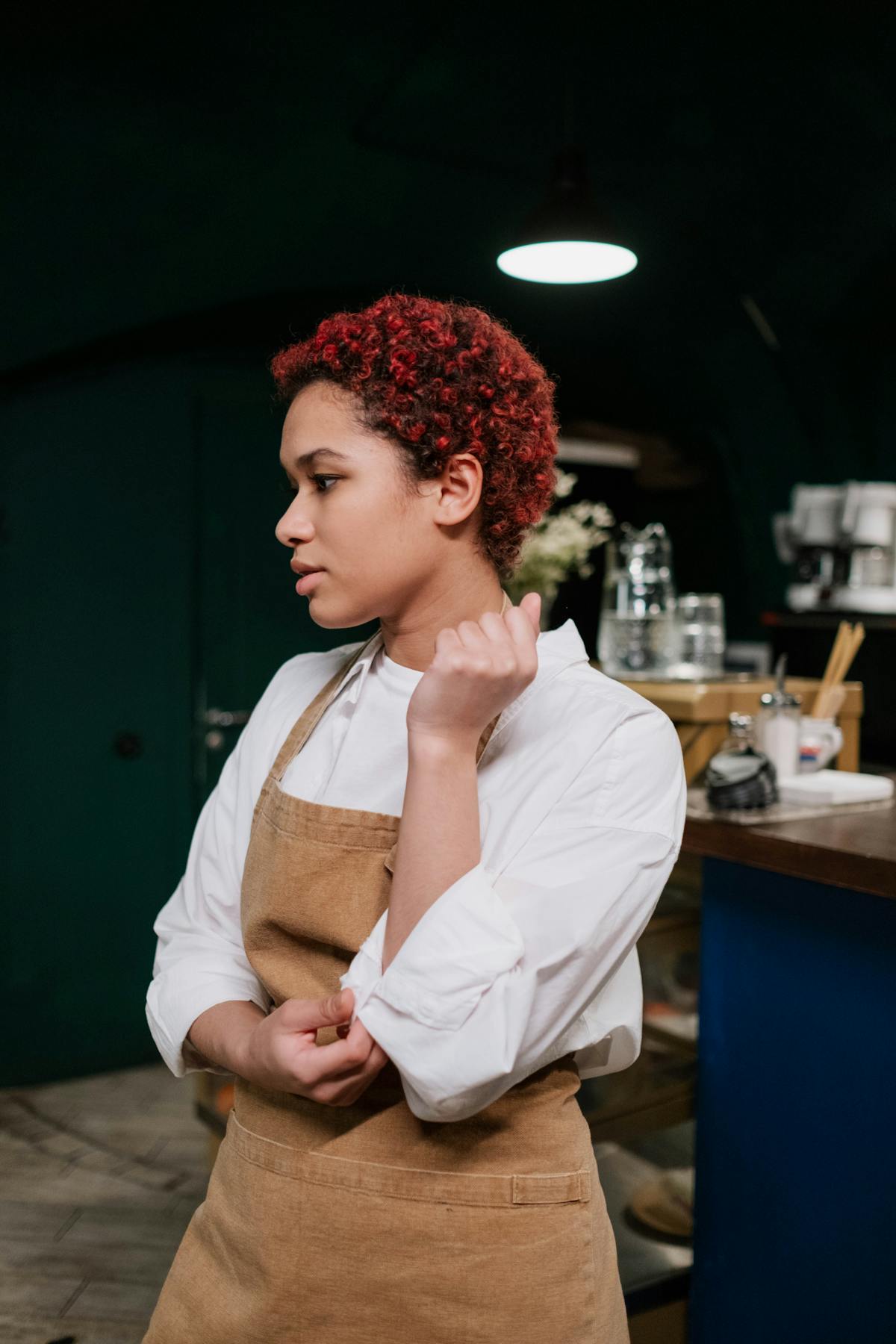 Person holding hardware crypto wallet and smartphone