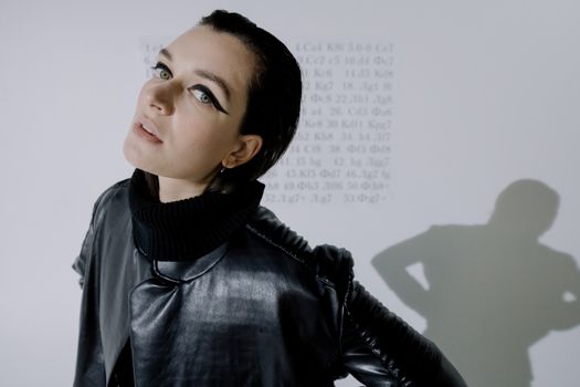 A Woman in a Black Turtleneck Top and Black Jacket