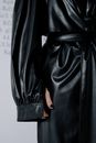 A Woman in Black Leather Trench Coat