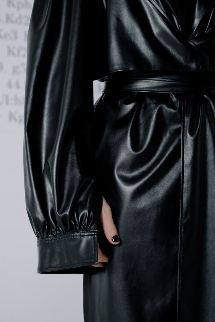 A Woman In Black Leather Trench Coat