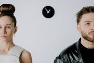Man in White Tank Top Beside Man in Black Leather Jacket