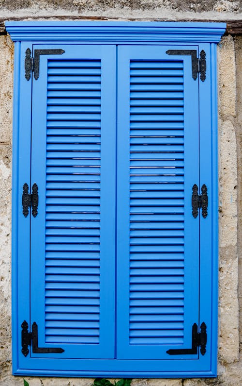 Closed Blue Window Shutters