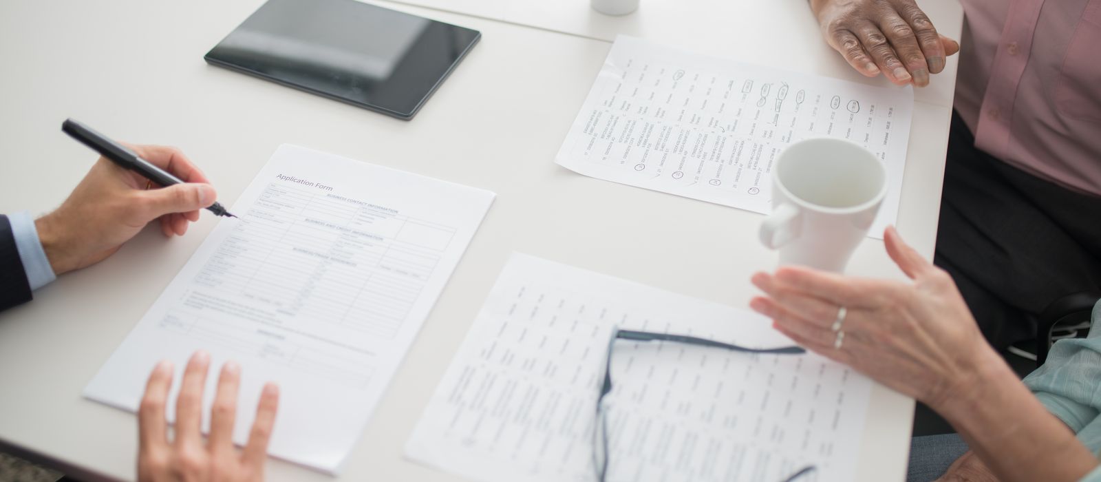 Reviewing a commercial insurance policy across a desk