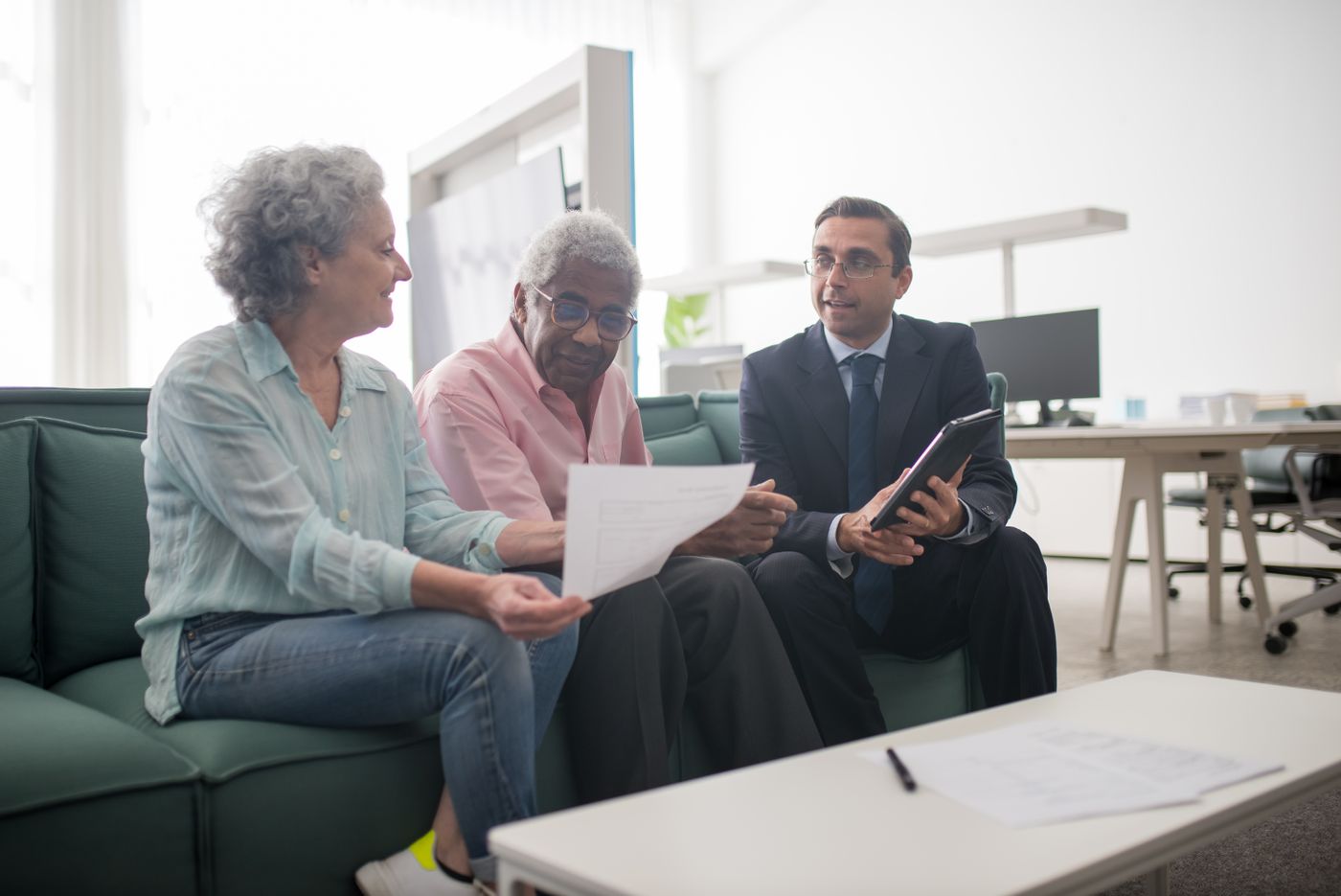 Senior couple discussing retirement plans with a financial advisor