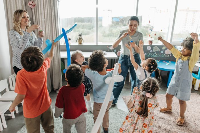 Children playing actively in the classroom