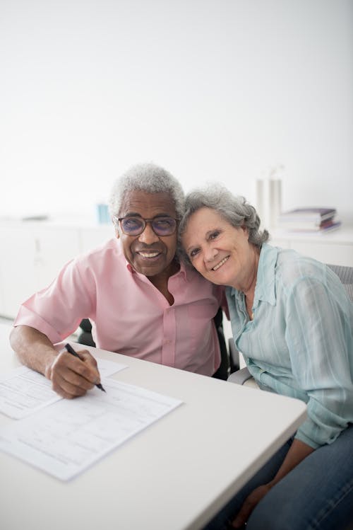 Elderly Clients Signing Documents