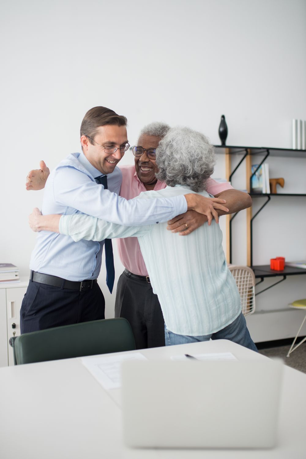 Members of the congregation sharing a joyful group hug