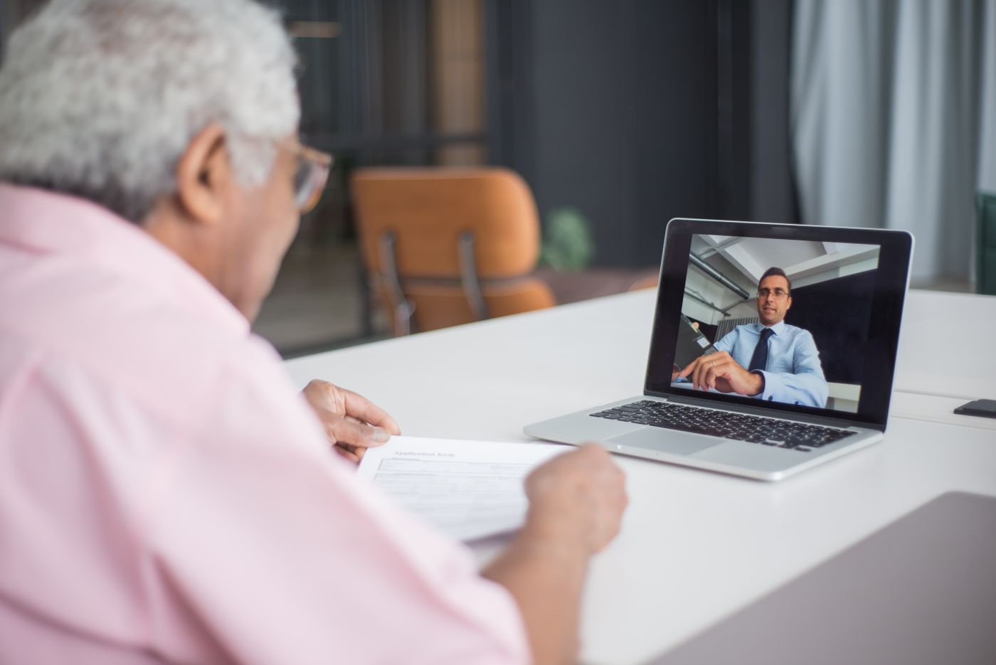 Business client on a remote video consultation with a consultant