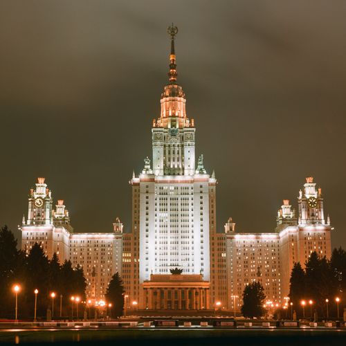 Free Stunning nighttime view of Moscow State University, beautifully illuminated with lights. Stock Photo