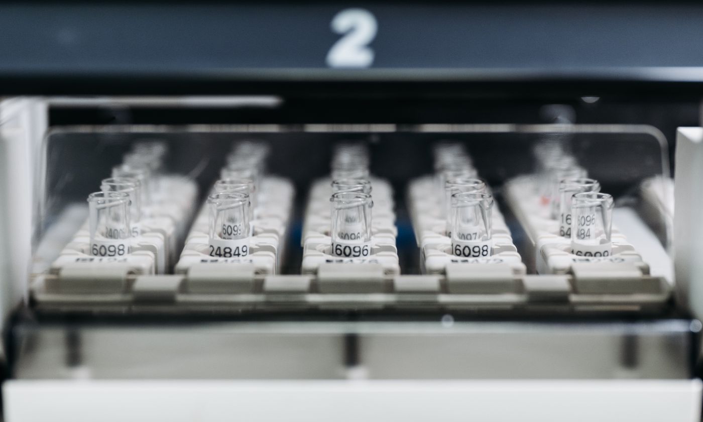 Laboratory vials positioned inside analytical equipment