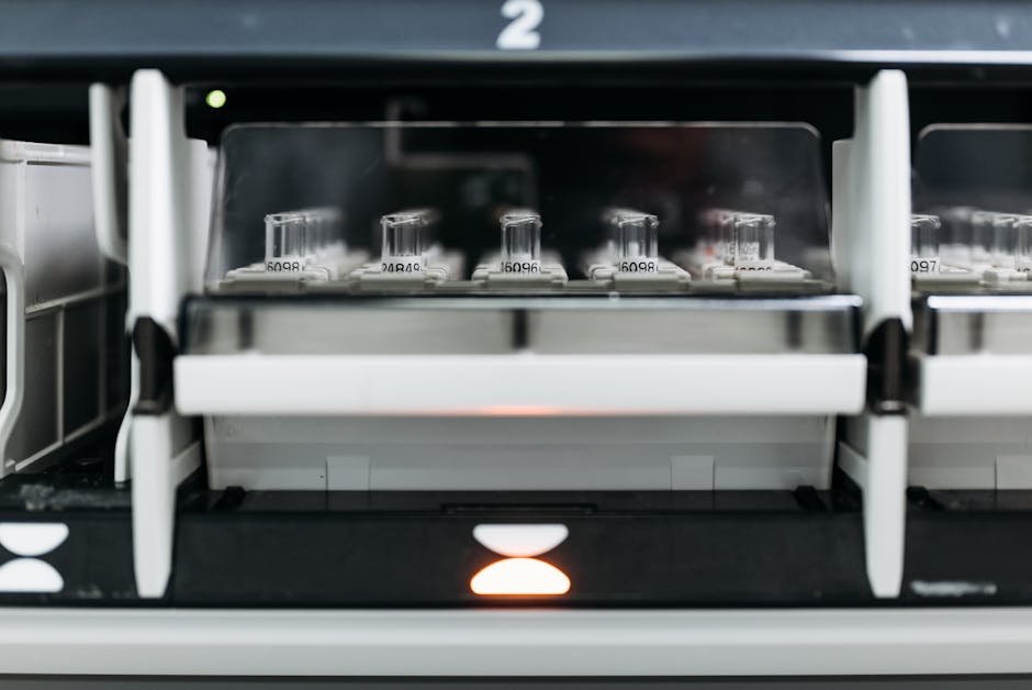Close-up of laboratory equipment with test tubes in a rack, showcasing modern scientific research to