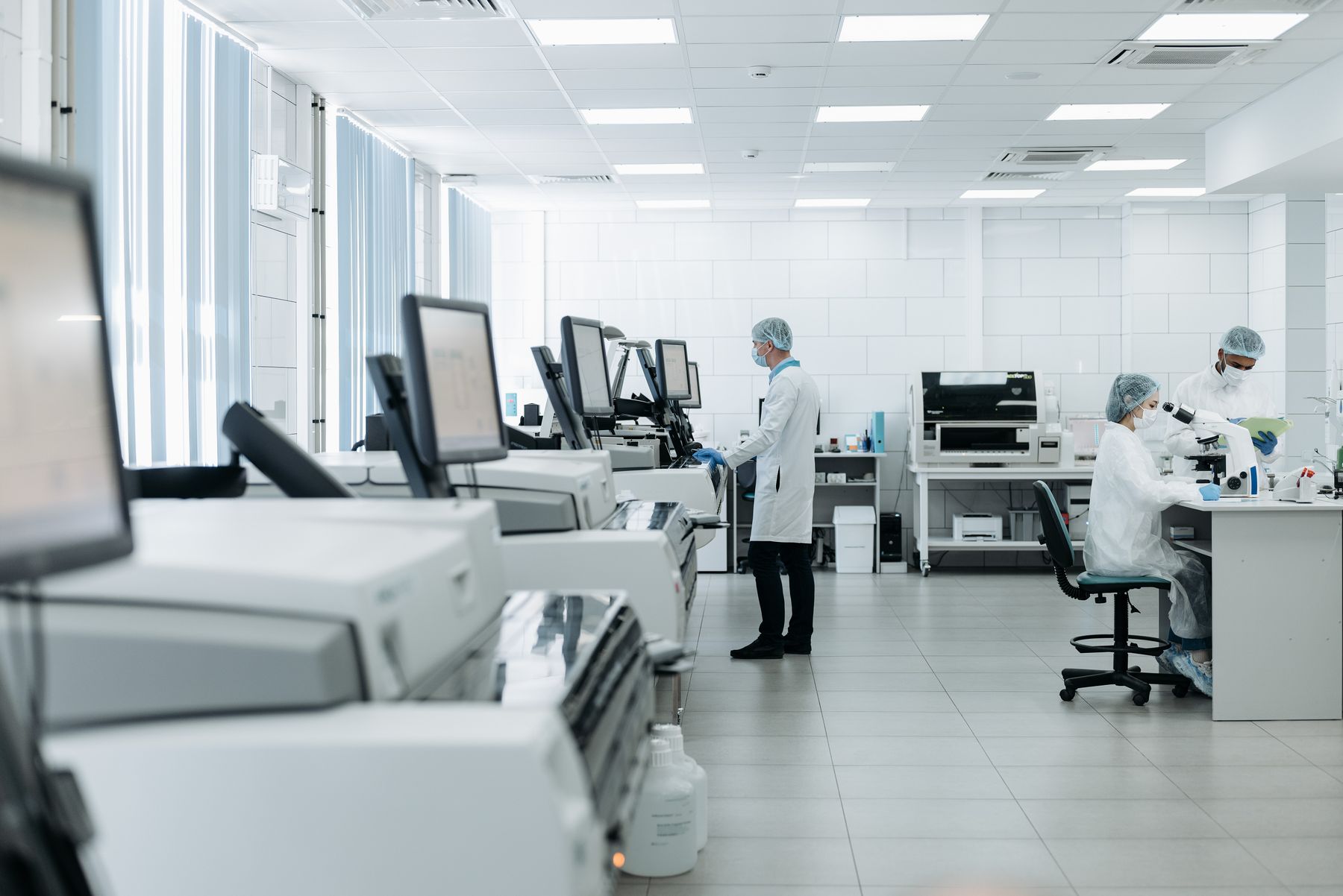 Medical researchers working with advanced clinical technology