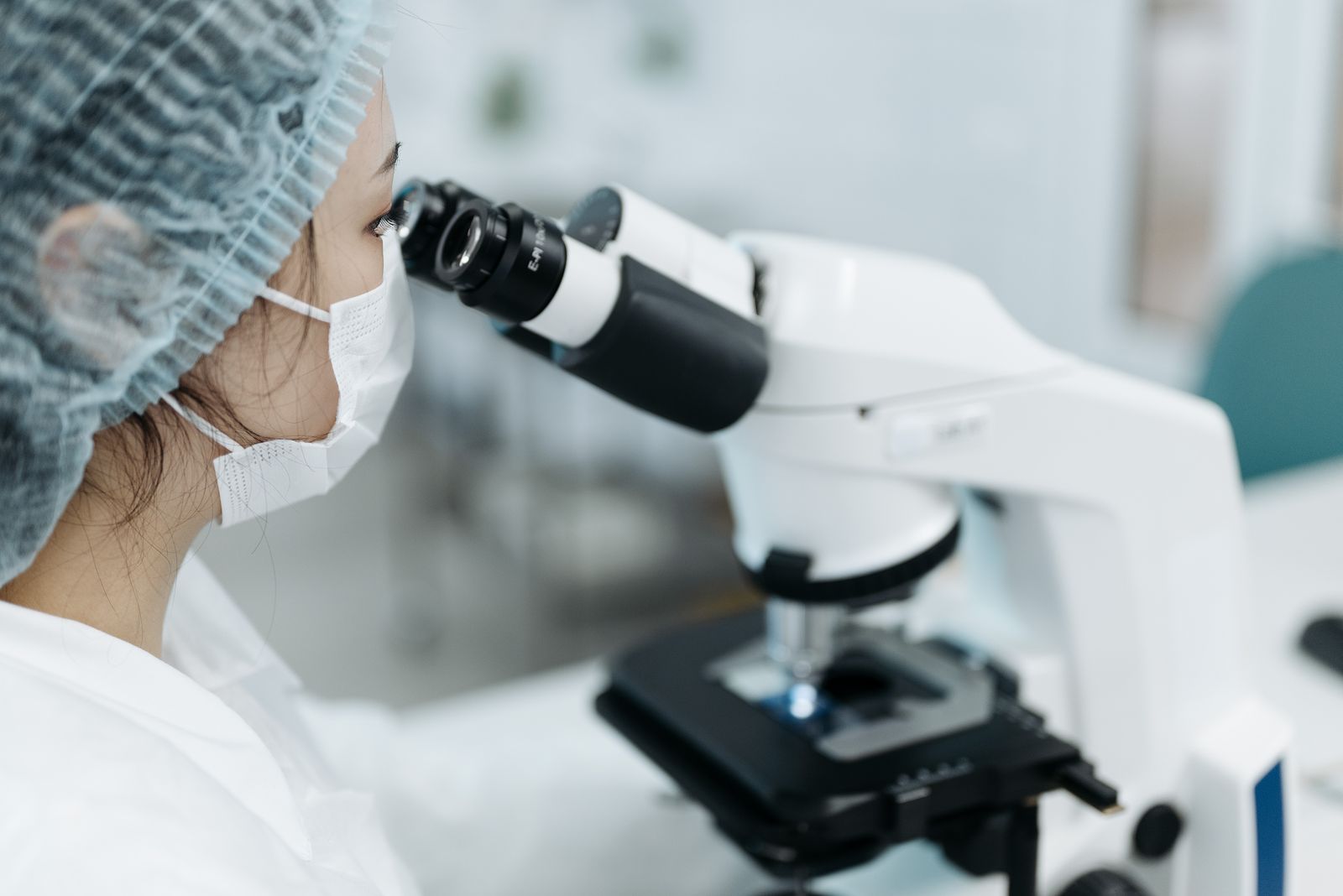 Laboratory professional performing microscopic examination
