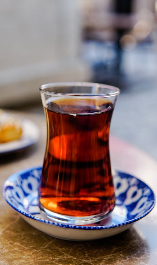 Clear Drinking Glass with Brown Liquid