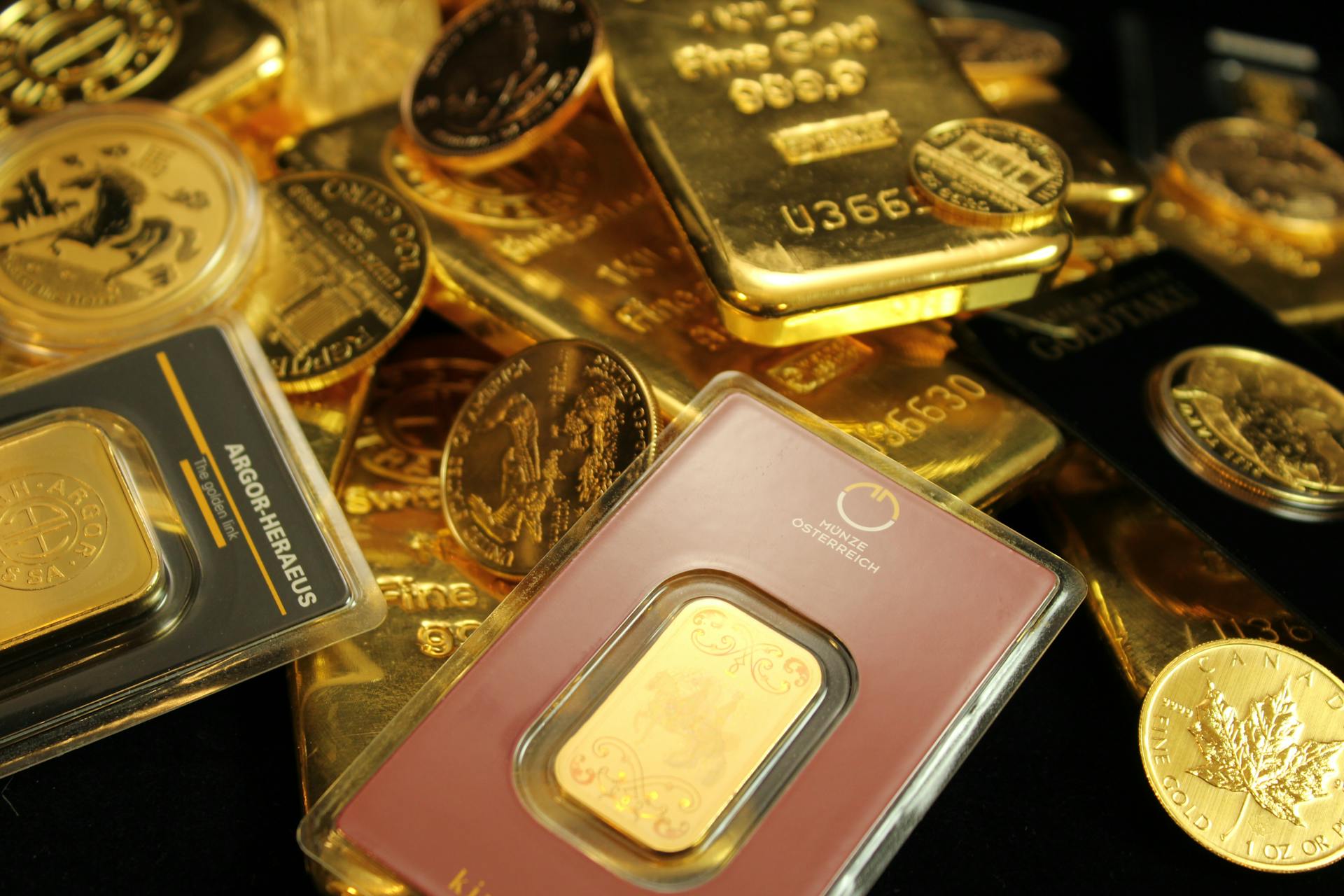 Detailed close-up of gold bars and coins symbolizing wealth and investment opportunities.