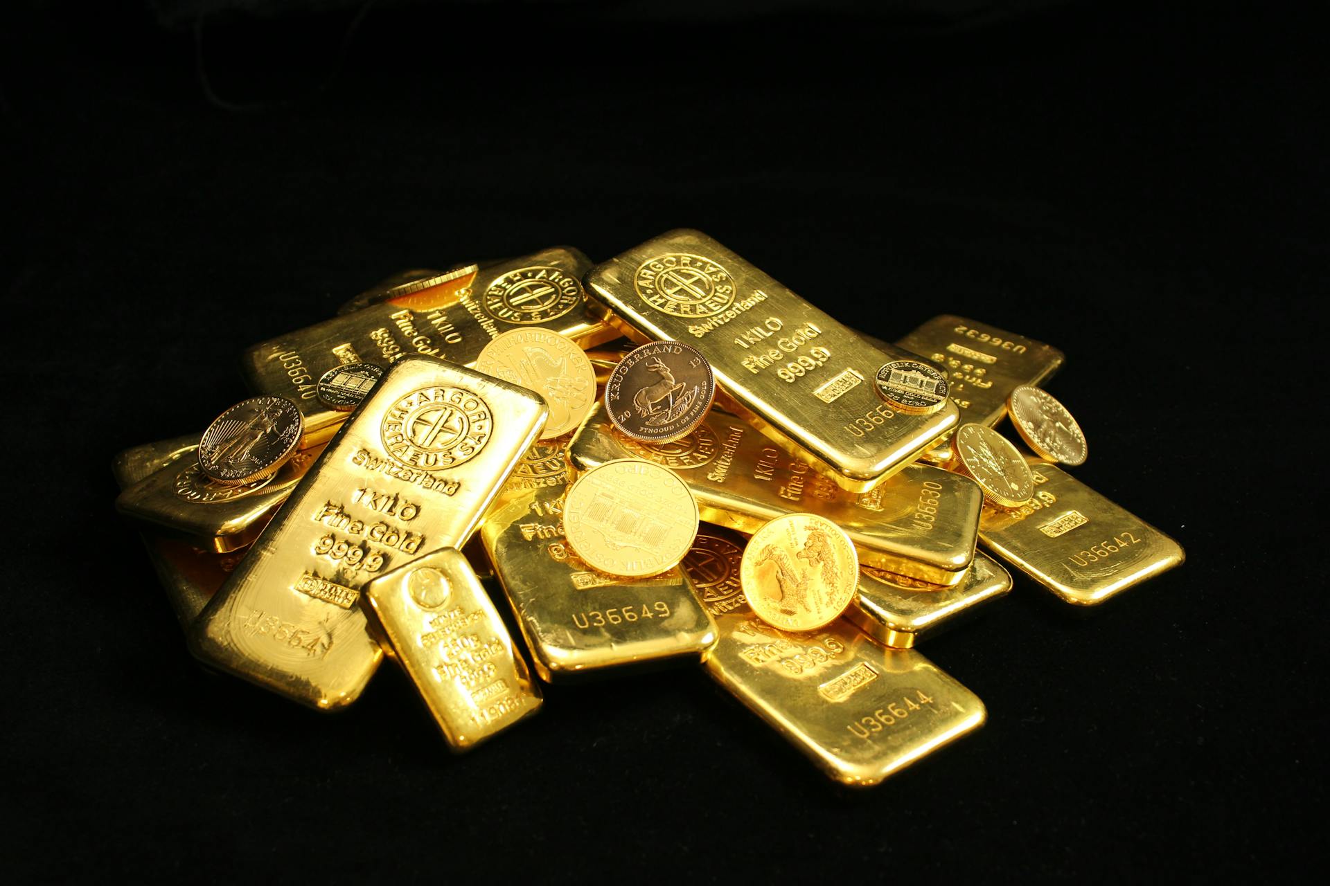 Close-up of shiny gold bars and coins symbolizing wealth and prosperity.