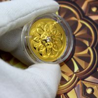 Gloved hand holding a gold coin in a protective casing — photo by Zlať&aacute;ky.cz on Pexels