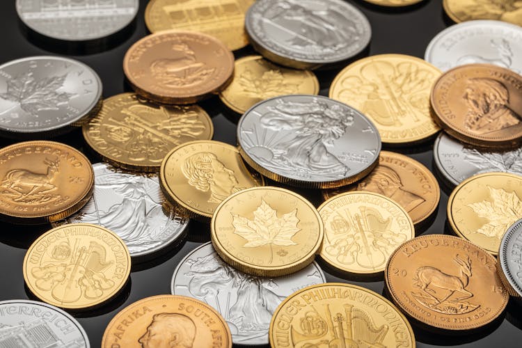 Collection Of Silver And Gold Round Coins 