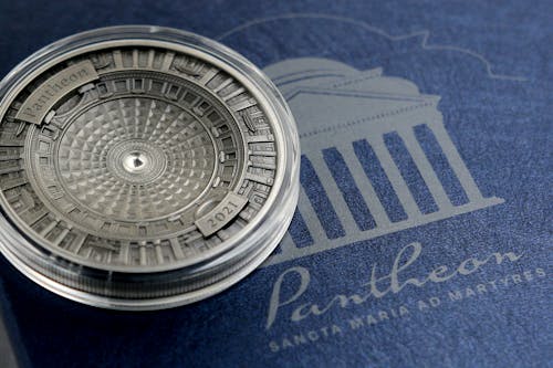 Free Silver Round Lid on Blue Textile Stock Photo