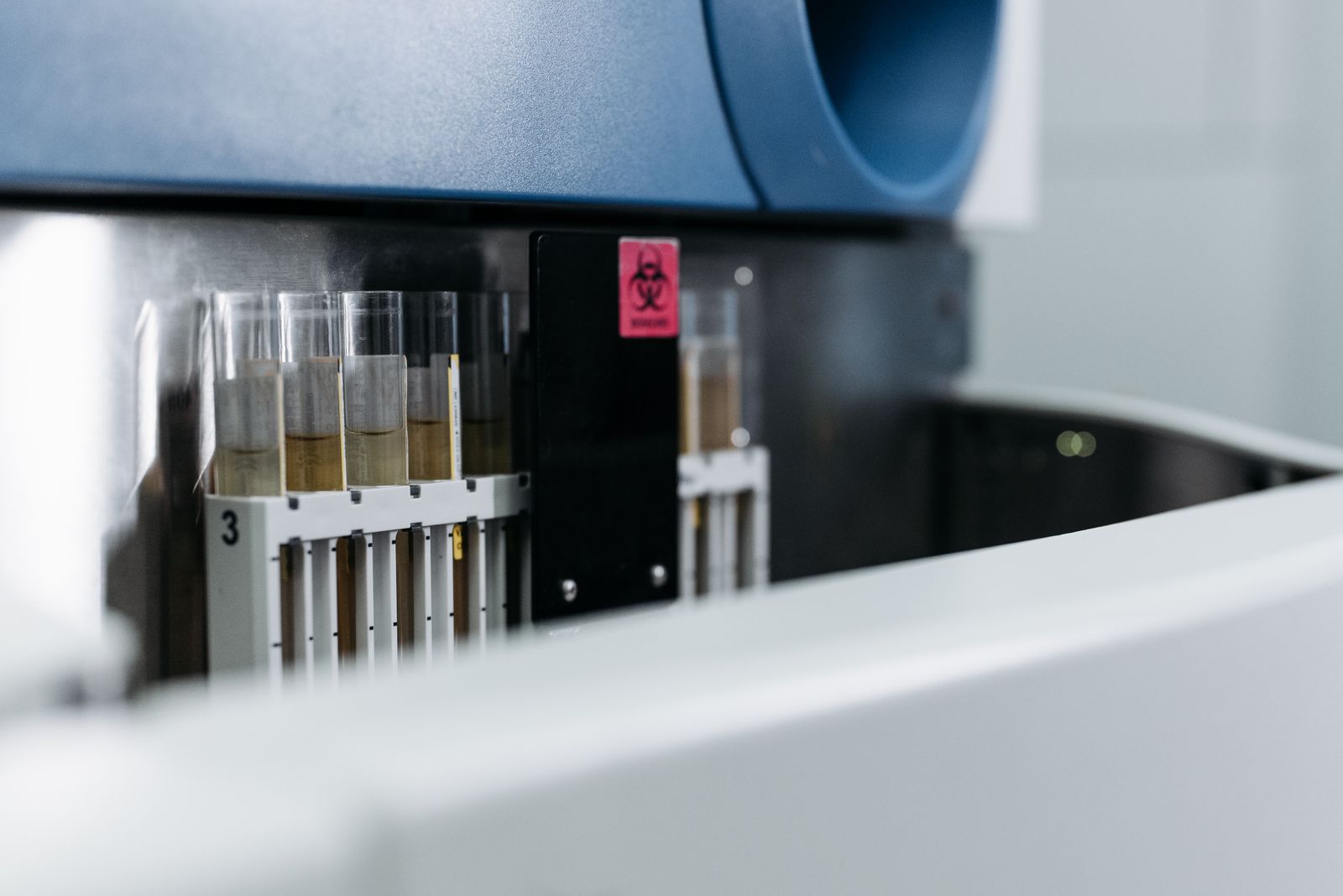 Test tubes on a rack in a laboratory, a real stock photo that echoes the blood-testing technology at the center of the Elizabeth Holmes story