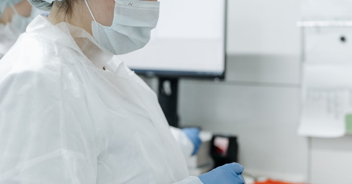 Laboratory technician handling samples in a sterile environment