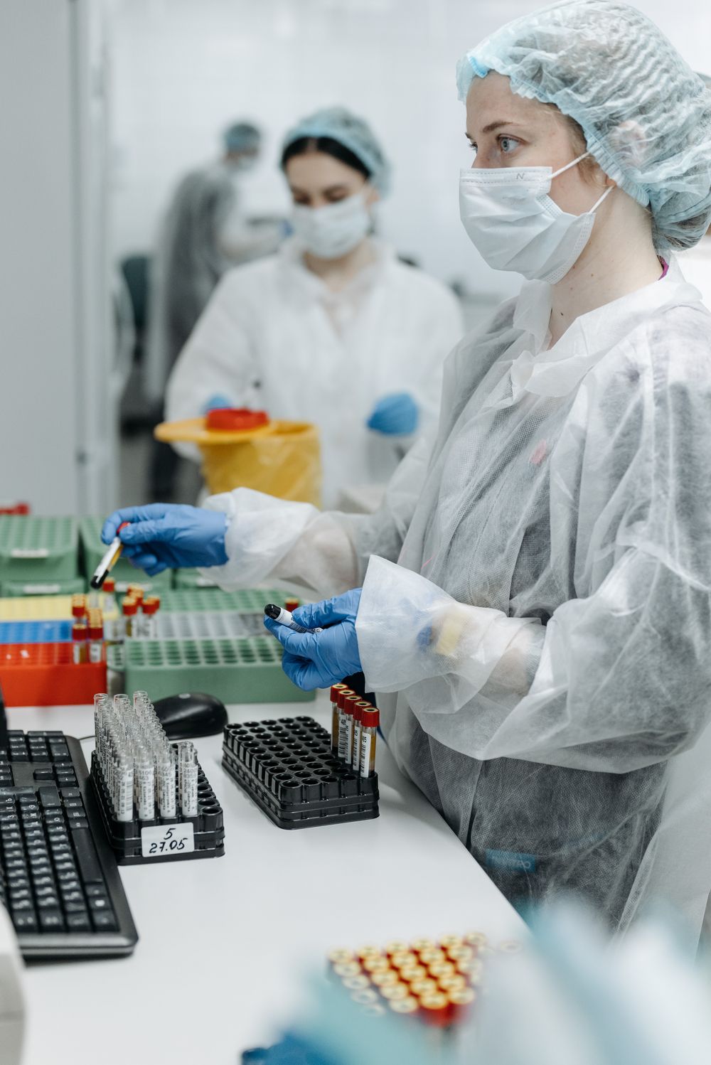 Lab technicians analysing samples in the Carebloom diagnostic laboratory