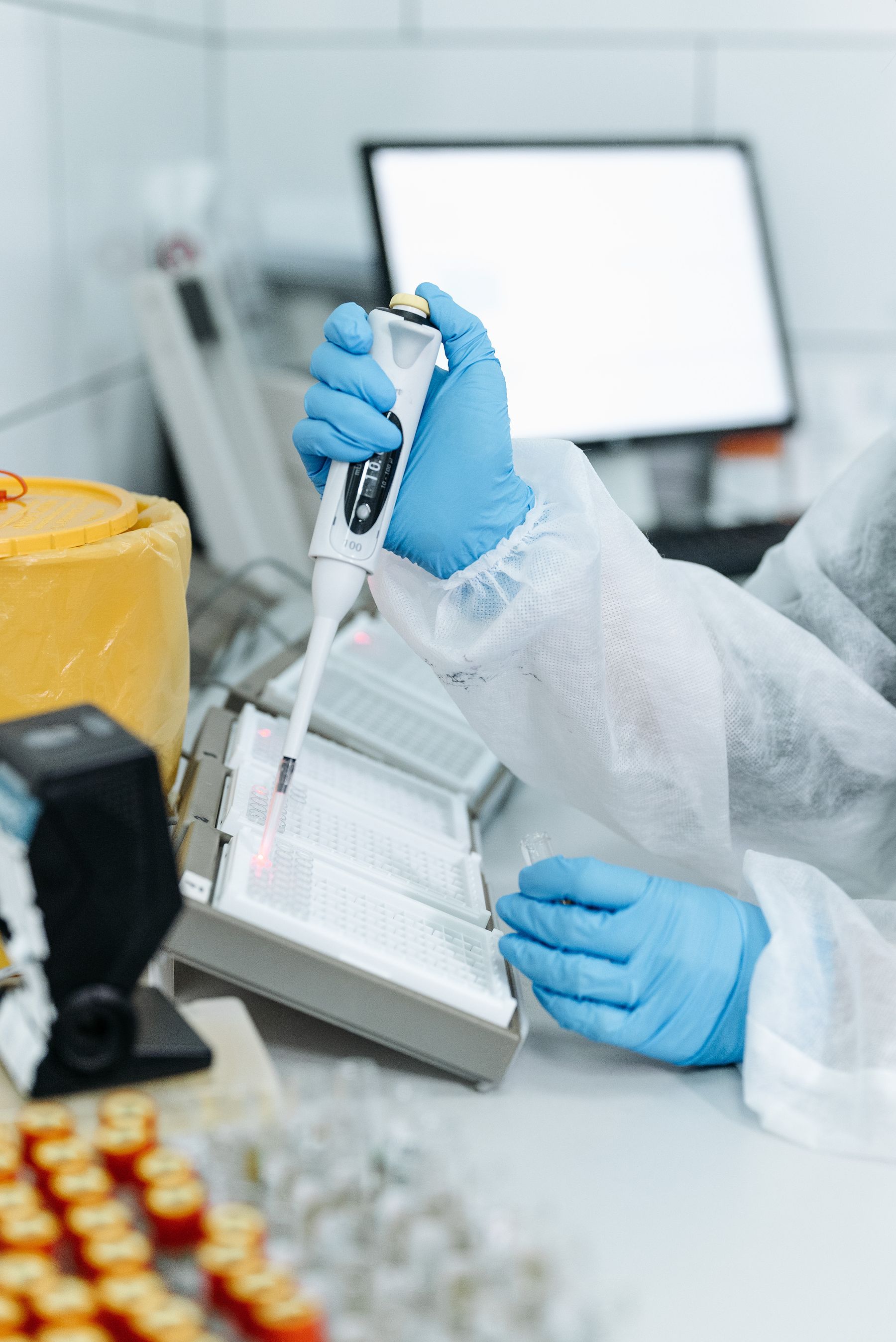 Molecular biology researcher working in a modern laboratory environment