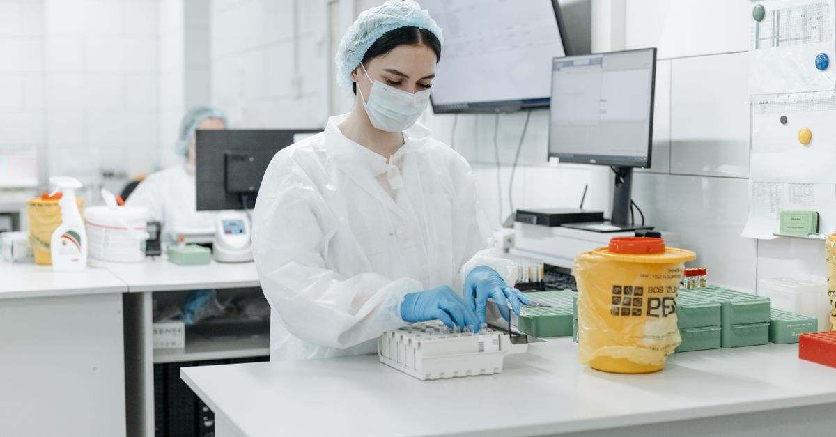 medical researcher analyzing DNA sequence data on computer screen