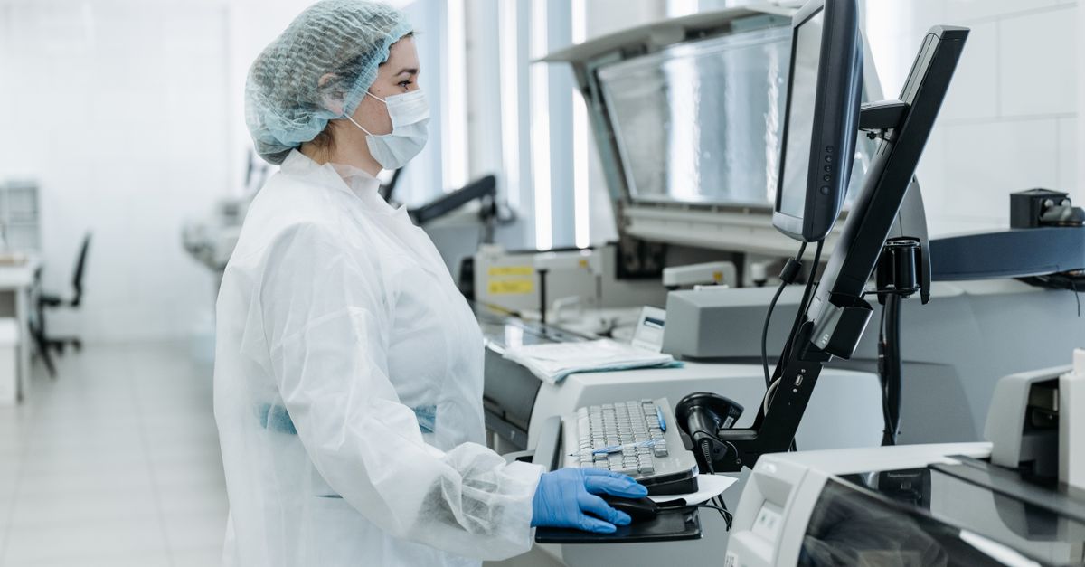 Woman using a Computer inside a Laboratory · Free Stock Photo