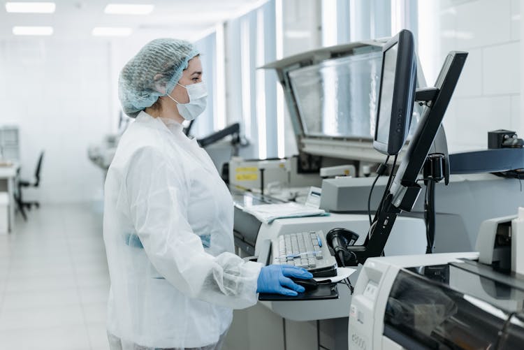 Woman Using A Computer Inside A Laboratory