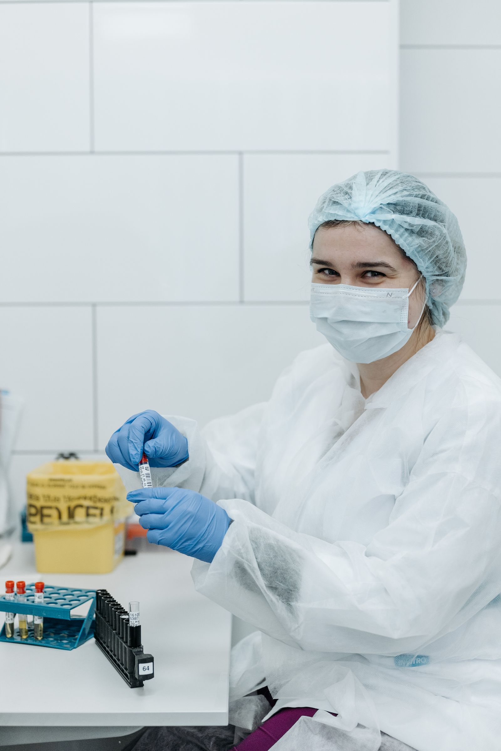 Laboratory professional holding a testing sample