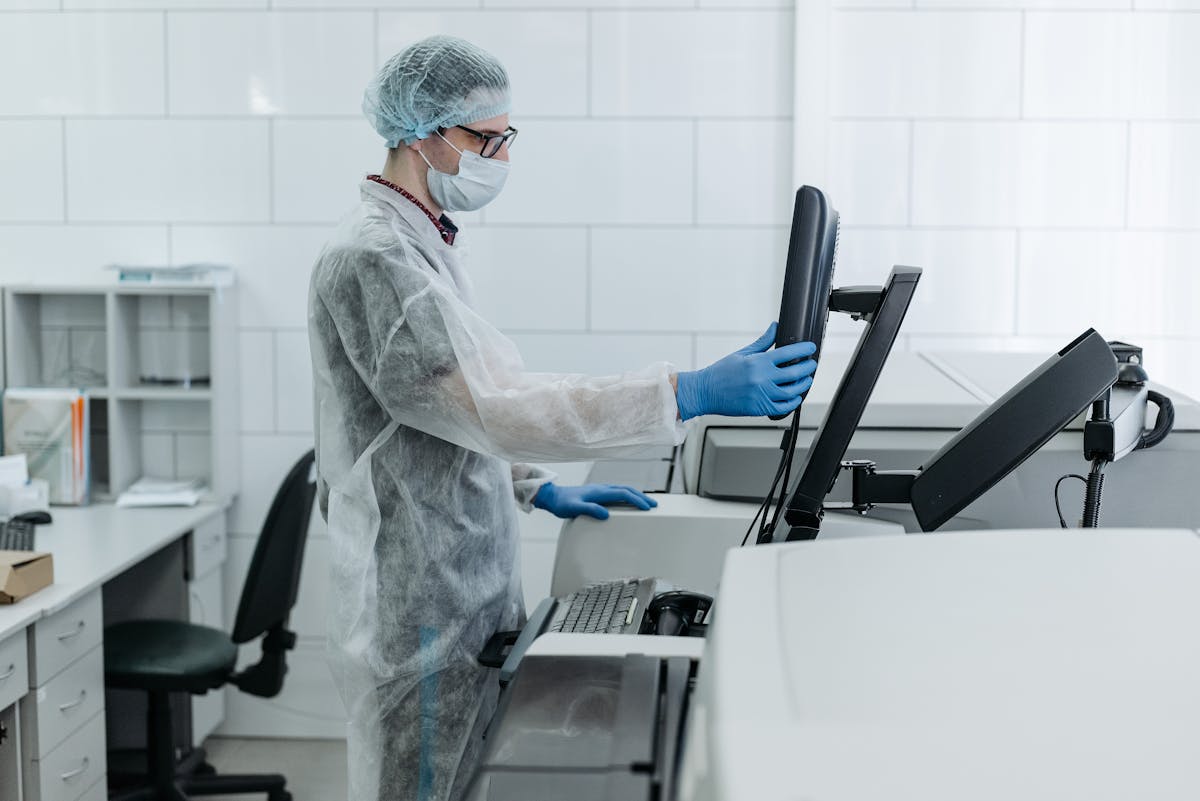 Organized hospital ward with healthcare workers wearing PPE
