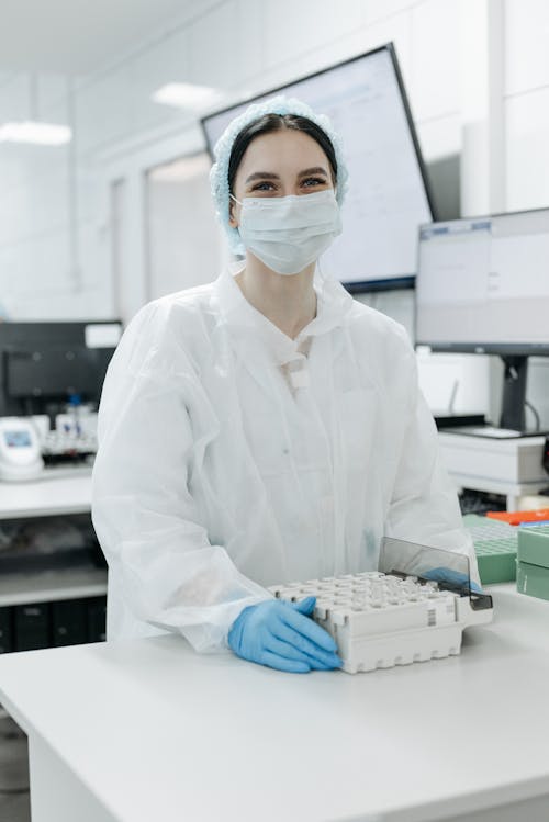 Female Medical Professional holding a Tray of Samples