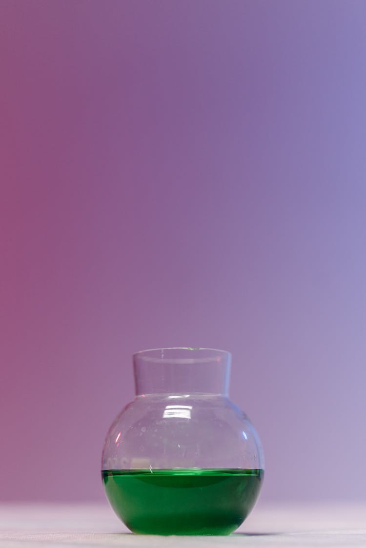 Clear Glass Bottle With Green Liquid