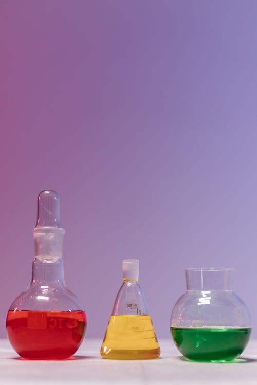 Free Colored Liquid on Laboratory Glassware  Stock Photo
