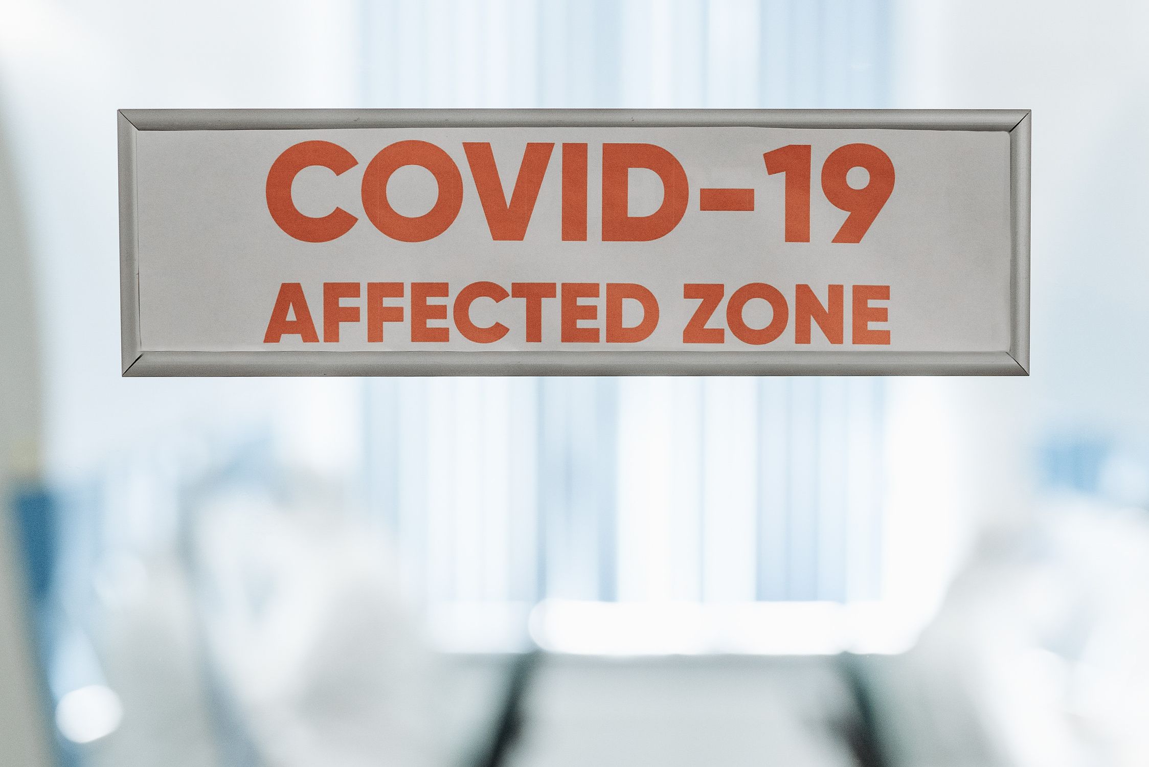Covid-19 Affected Zone Sign on a Door · Free Stock Photo