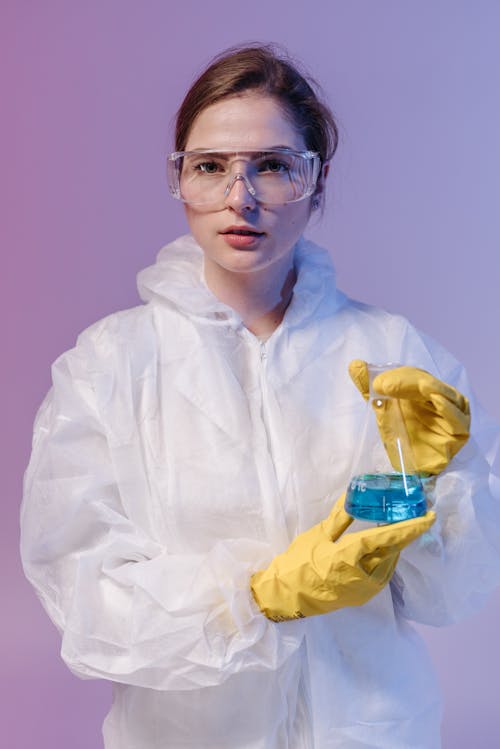 Female Medical Professional holding an Erlenmeyer Flask 