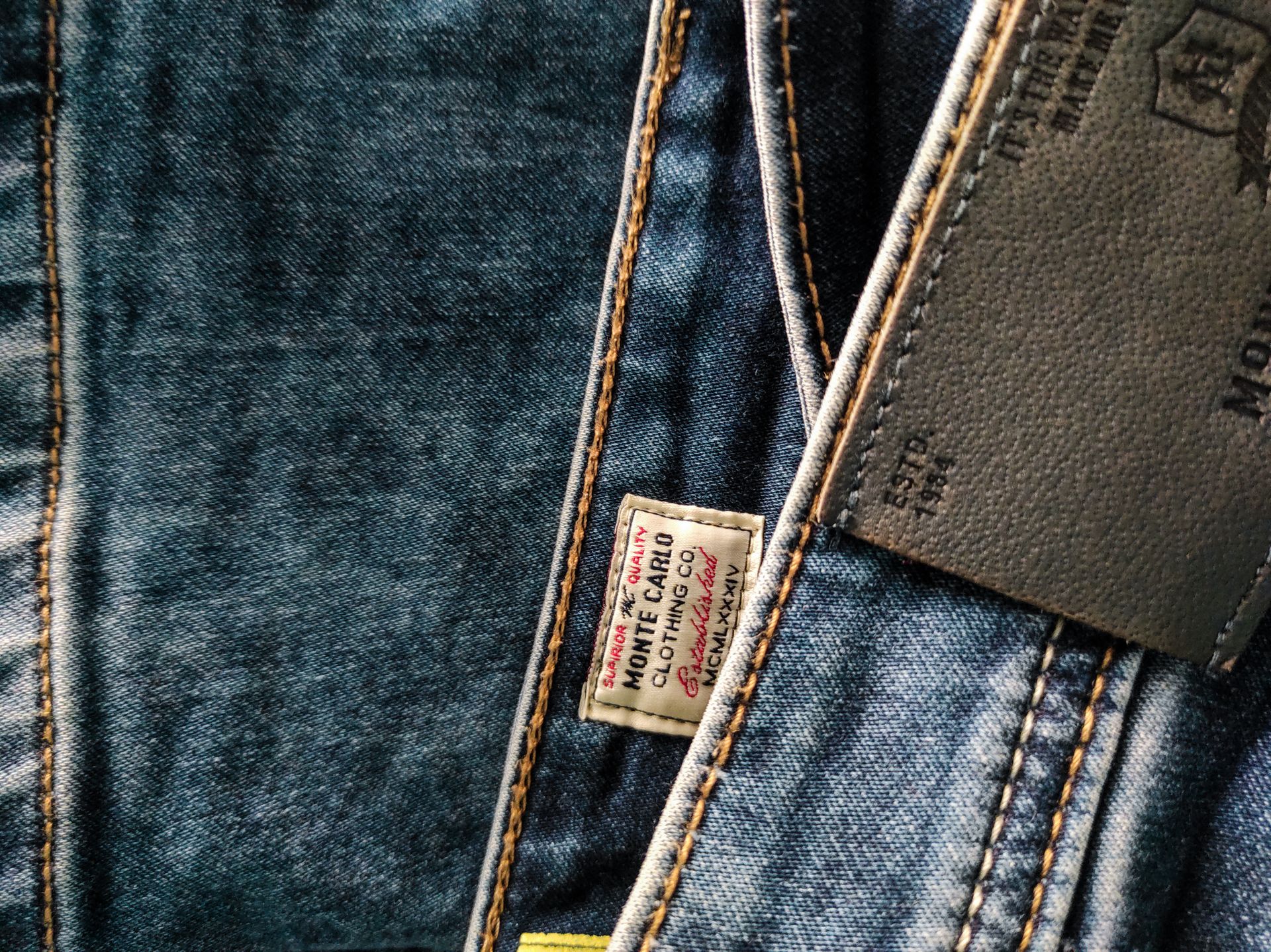 Leather patch on denim jeans with brand label
