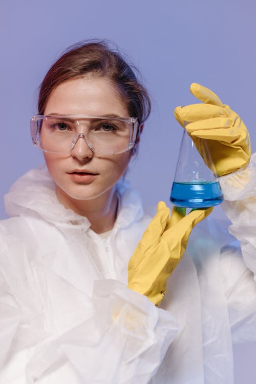 Female Medical Professional holding an Erlenmeyer Flask 