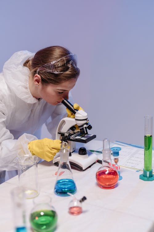Free Female Medical Professional doing an Experiment   Stock Photo