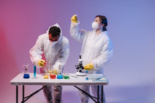 Free Medical Professionals doing an Experiment   Stock Photo