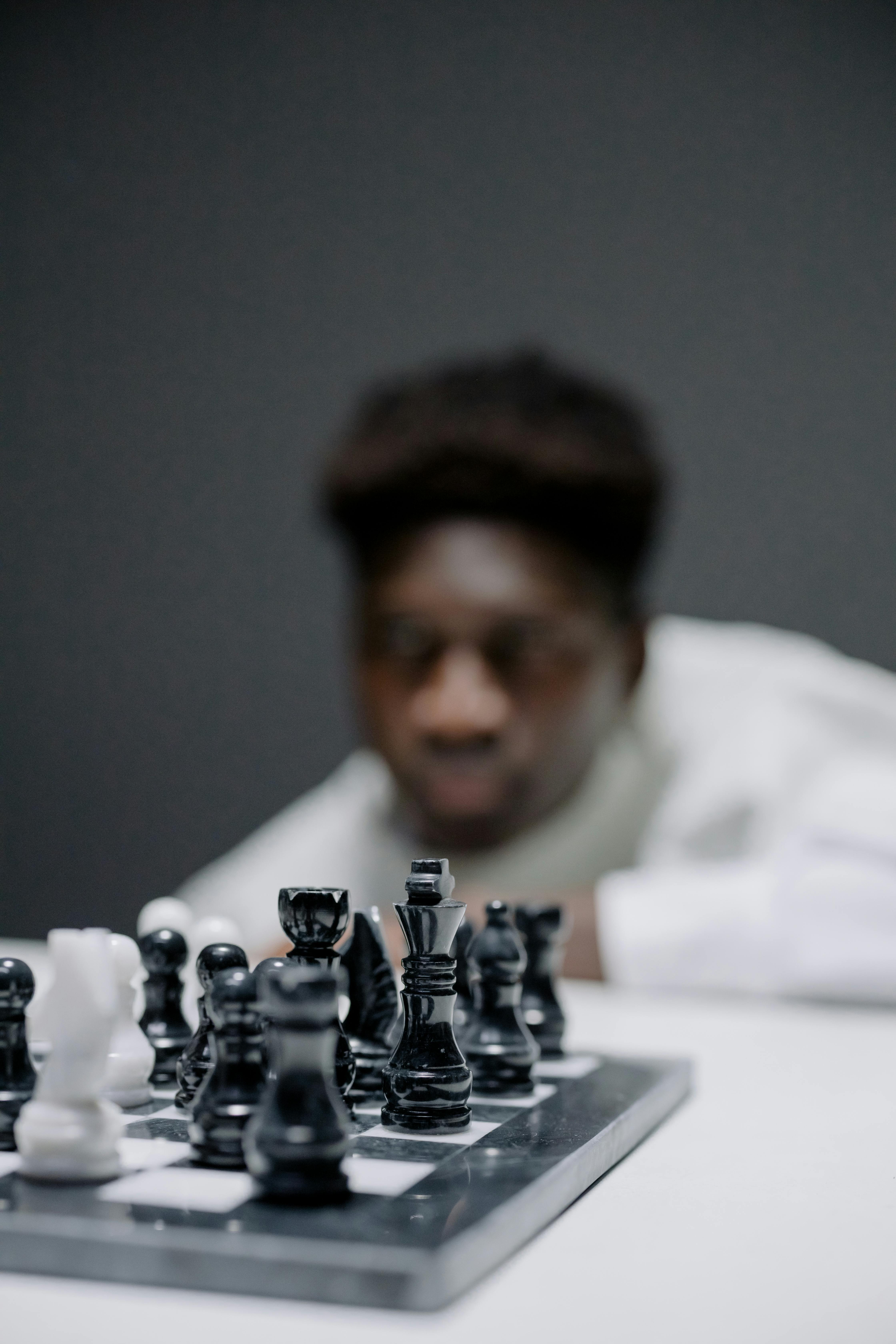 Caucasian man playing chess computer hi-res stock photography and