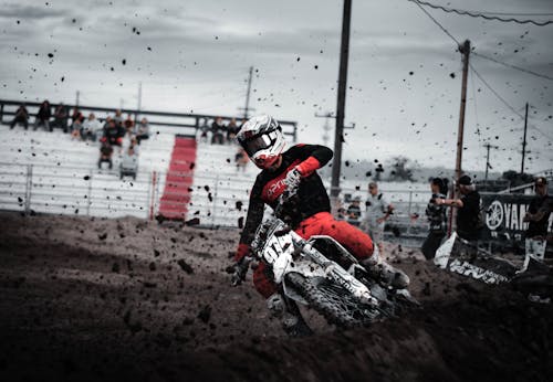 Man driving a Dirt Bike on an Obstacle Course 