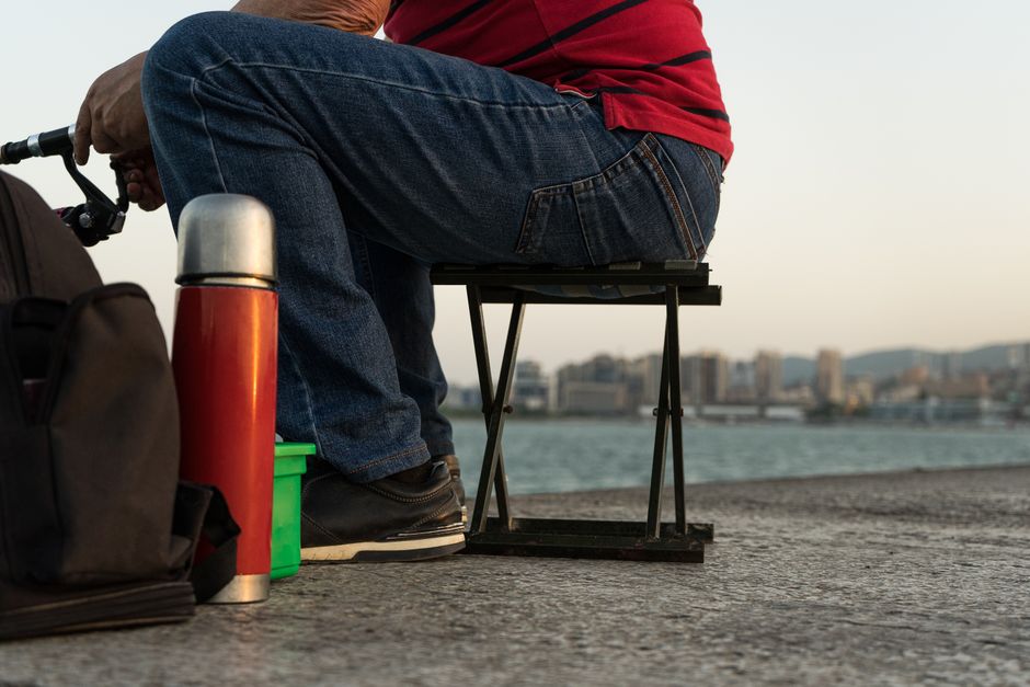 portable folding seat cushion on backpack