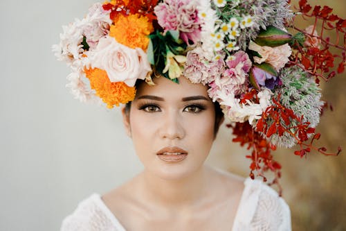 Portrait of a Beautiful Woman Wearing a Flower Headress