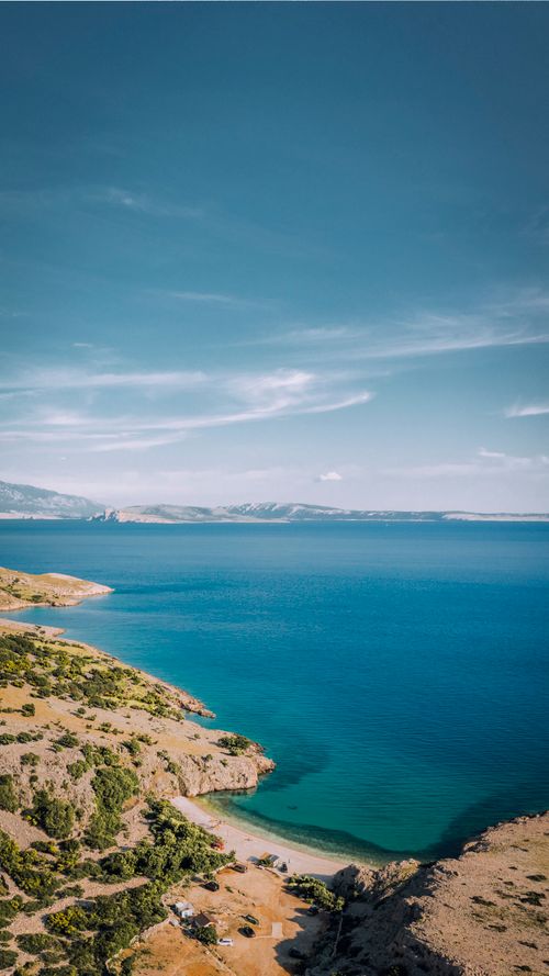 Free Discover the breathtaking aerial view of Krk Island's azure coastline and natural beauty in Croatia. Stock Photo