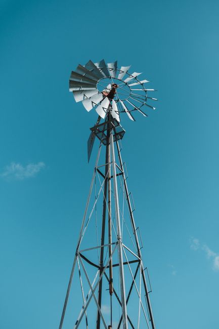 A striking windmill stands tall against a clear blue sky in Kissimmee, Florida.