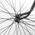 Black and white macro of a spoked wheel hub, photo by Leonid Danilov on Pexels