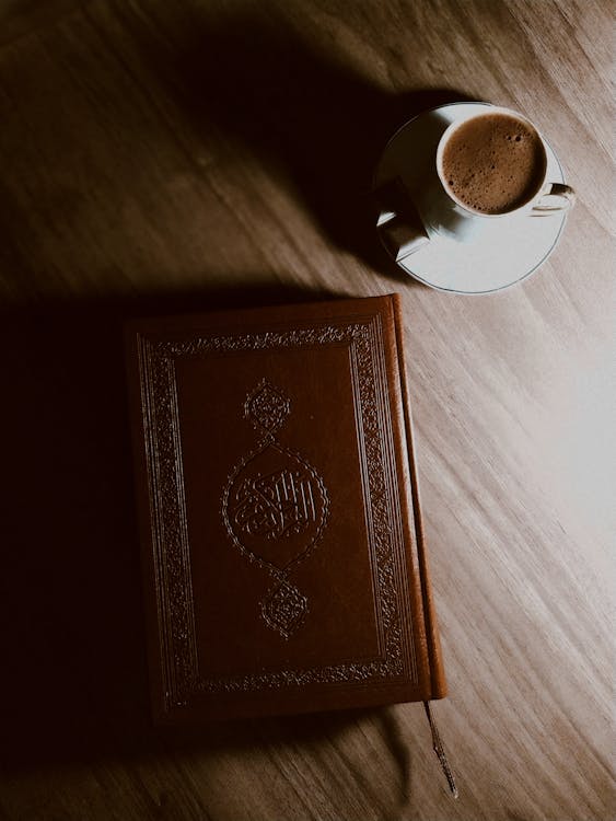 Brown Book on Brown Wooden Table